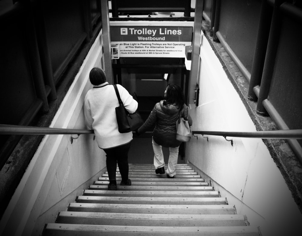 two people going down stairs