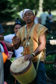 man playing hand drum