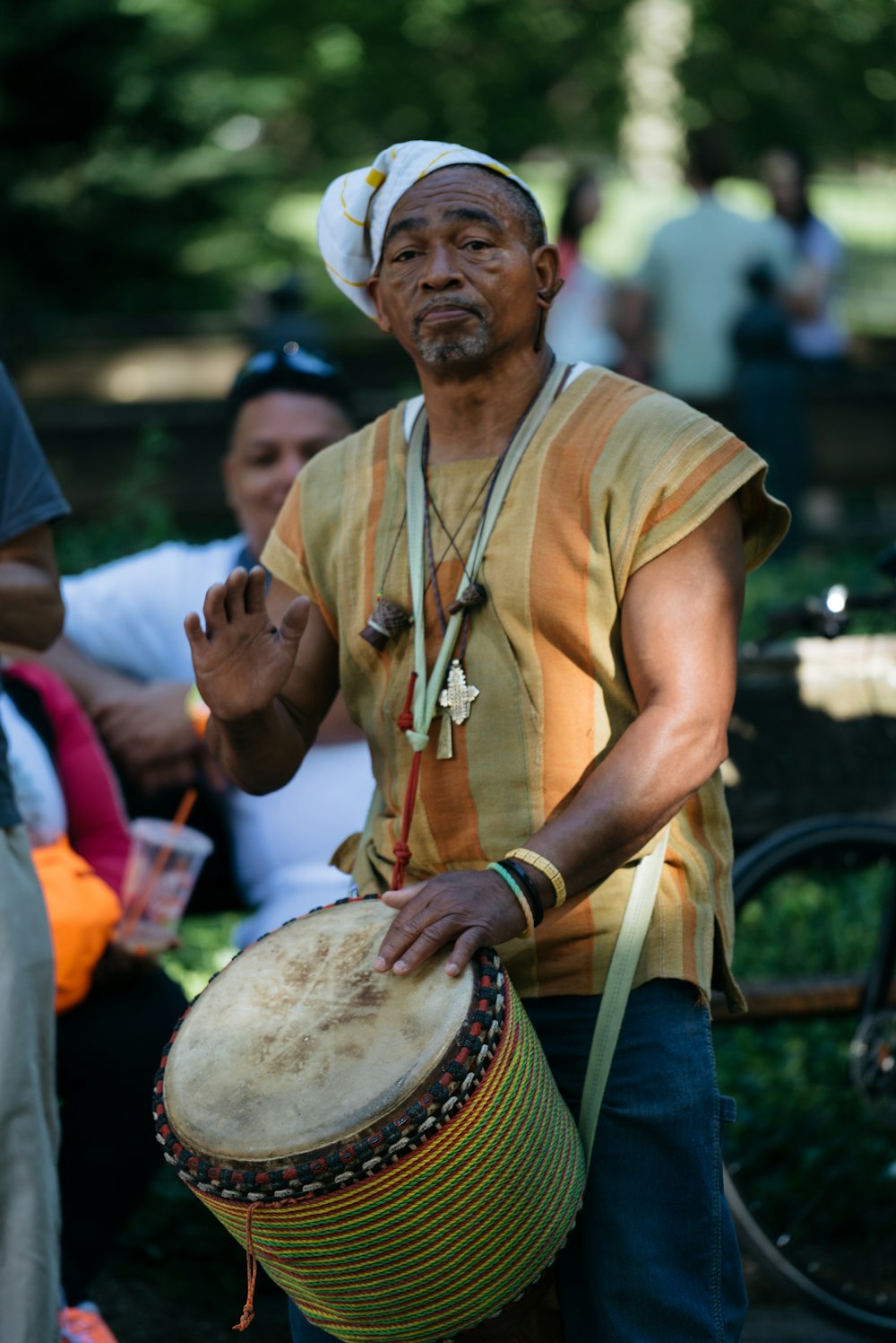man playing hand drum