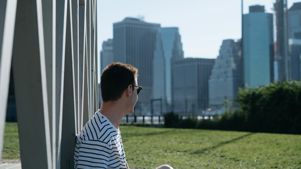 man wearing white and black striped shirt