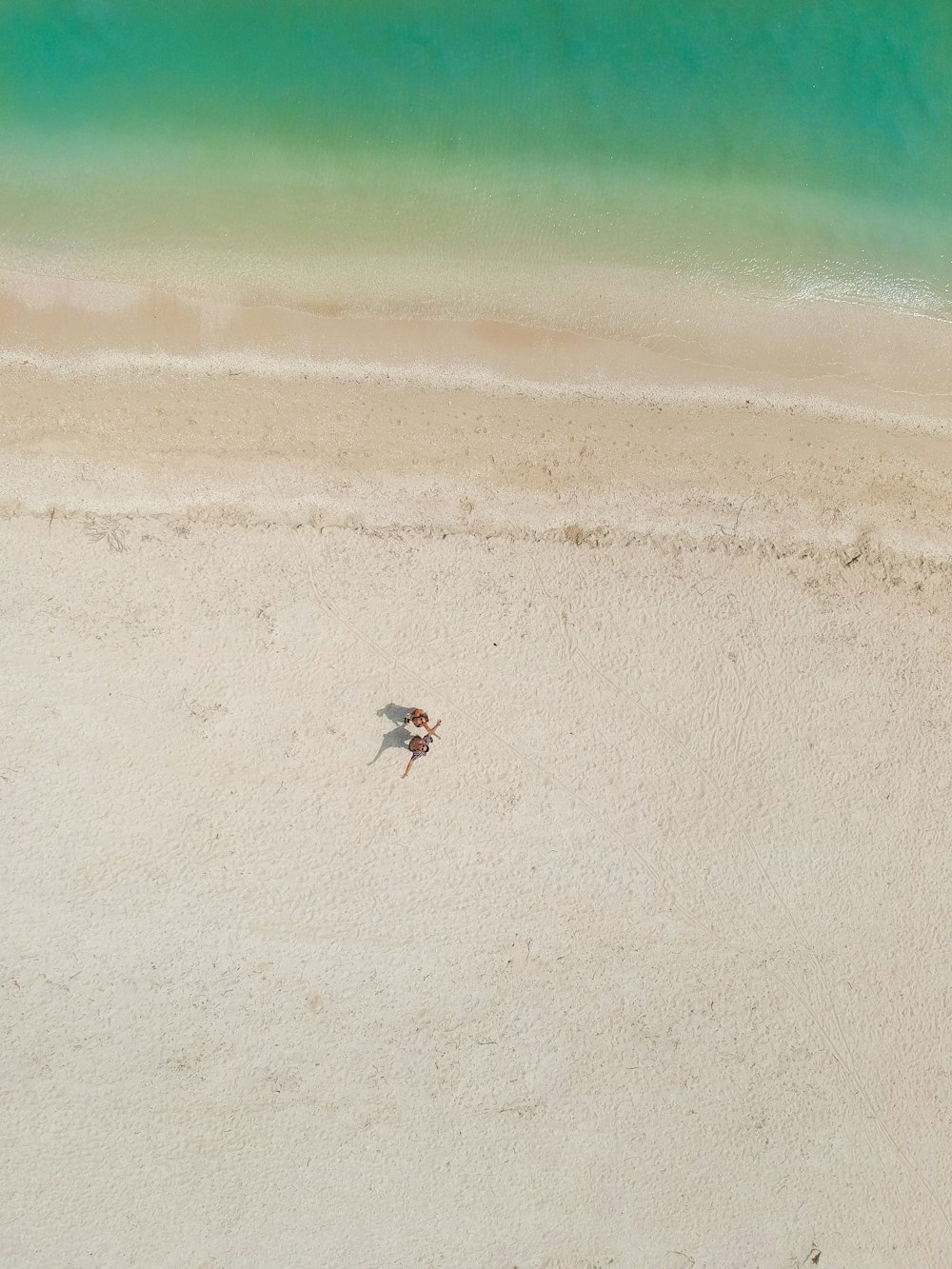 person standing at the shore during daytime