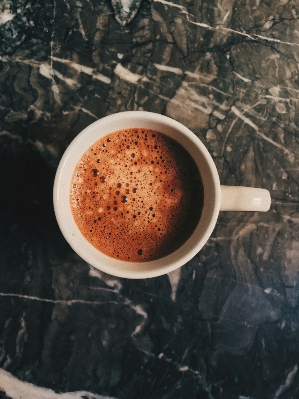 brown liquid in white ceramic cup