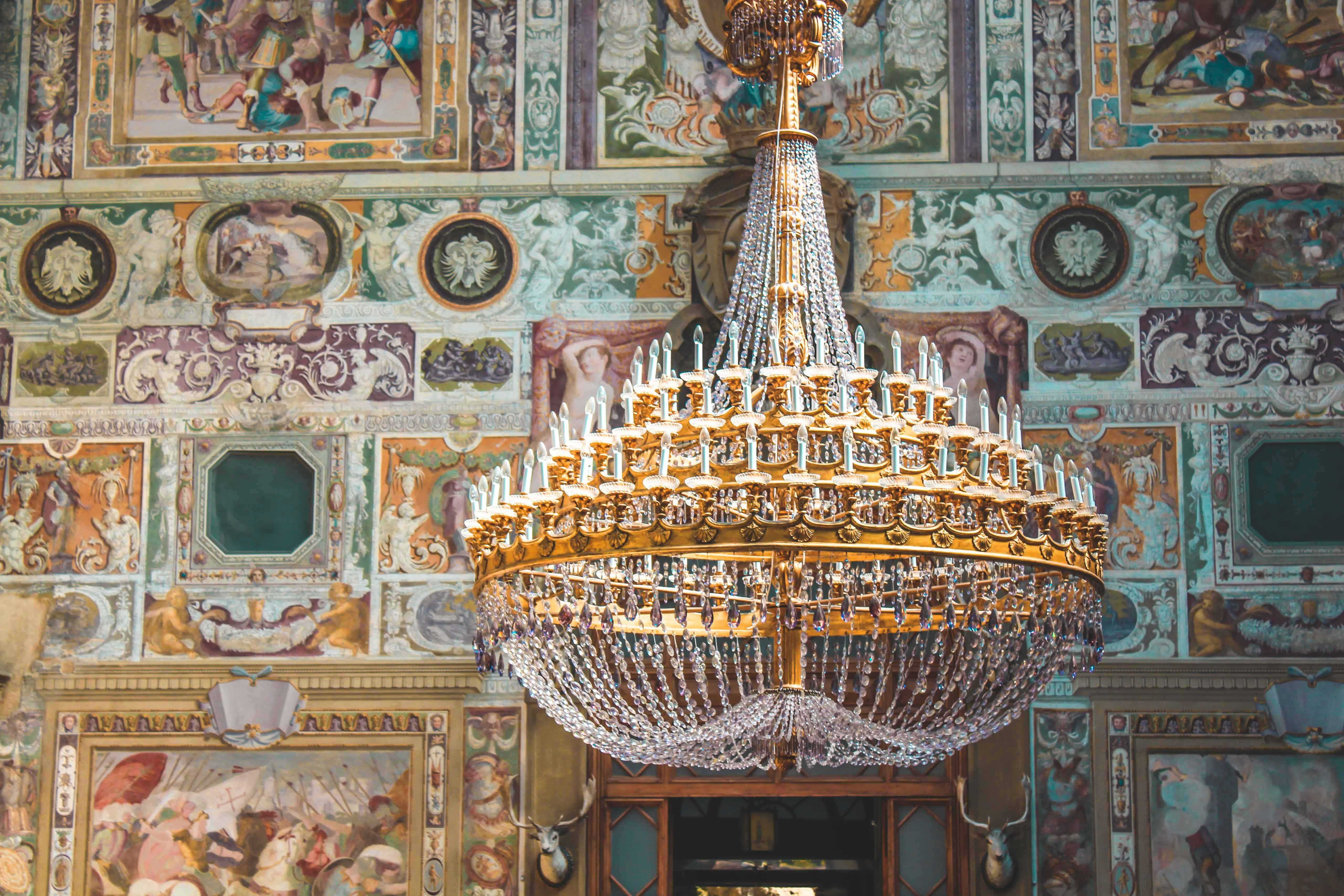 Gold chandelier in painted wall room