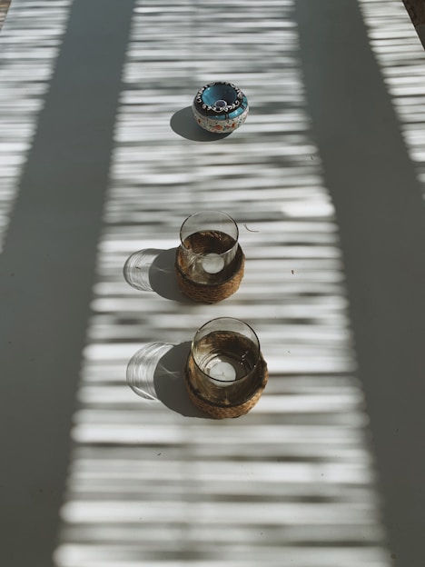 Peaceful morning scene with religious items displayed softly on a wooden table, inviting calm and devotion
