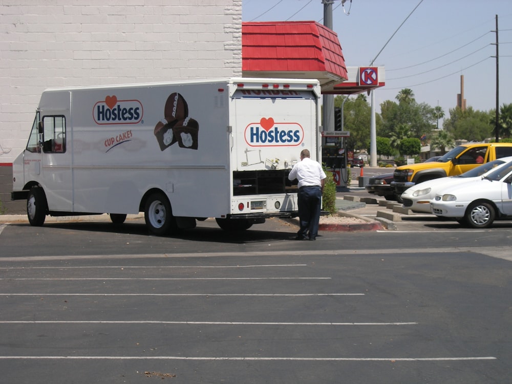 white Hostes truck on road