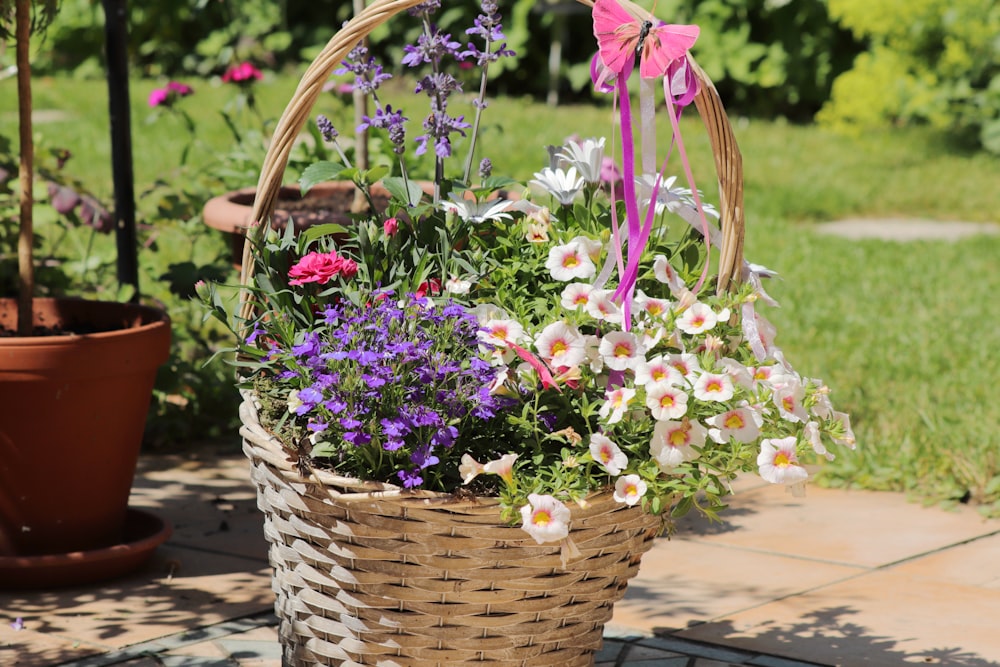 basket full of assorted flowers