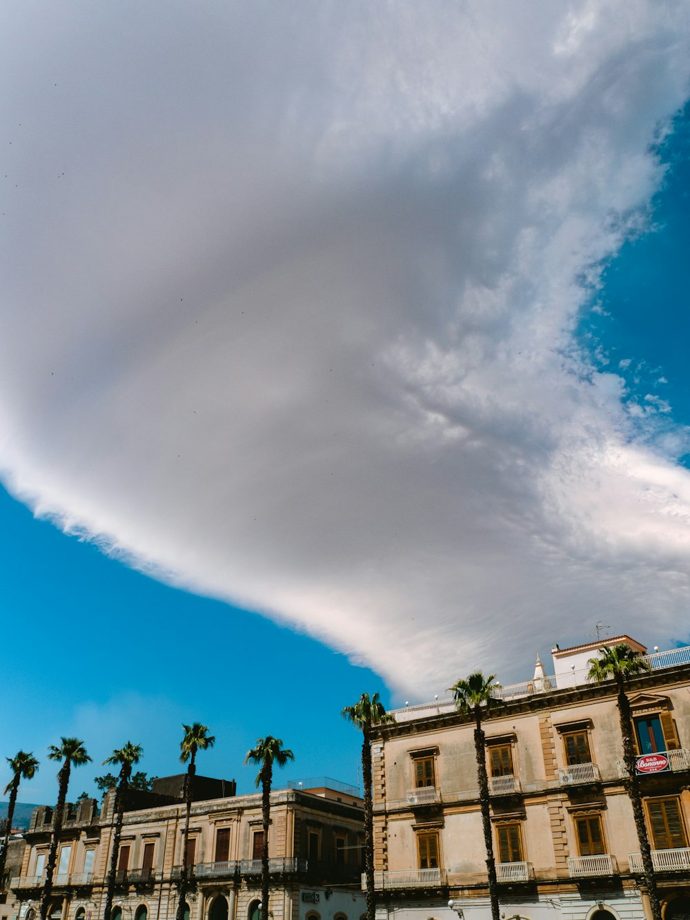 white clouds over houses