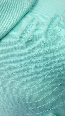Close-up of soft fabric and trendy font detail on a mint green hygiene tee.