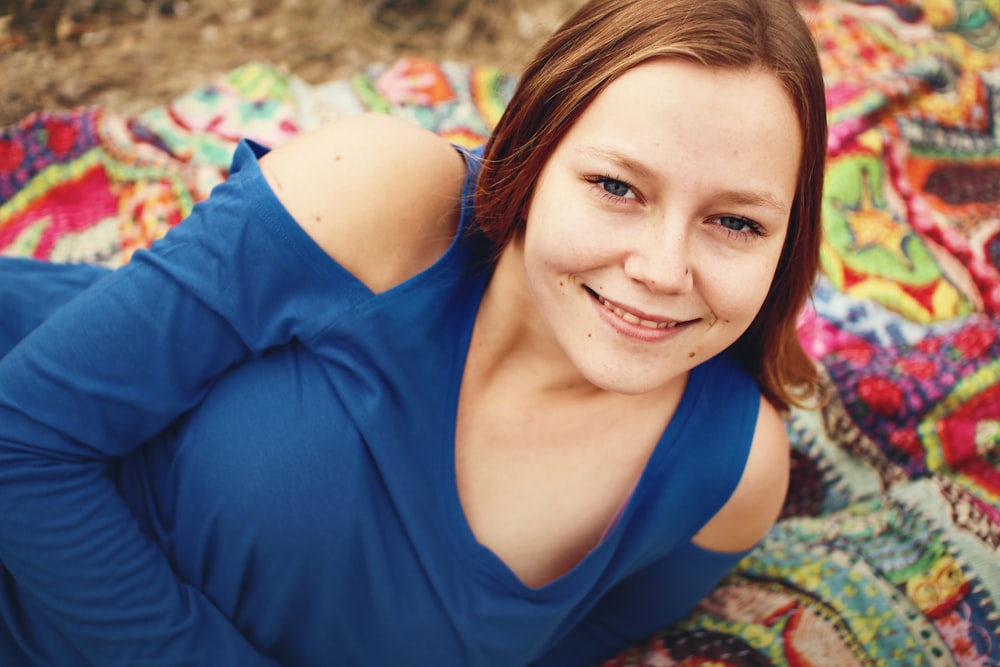 woman lying on textile