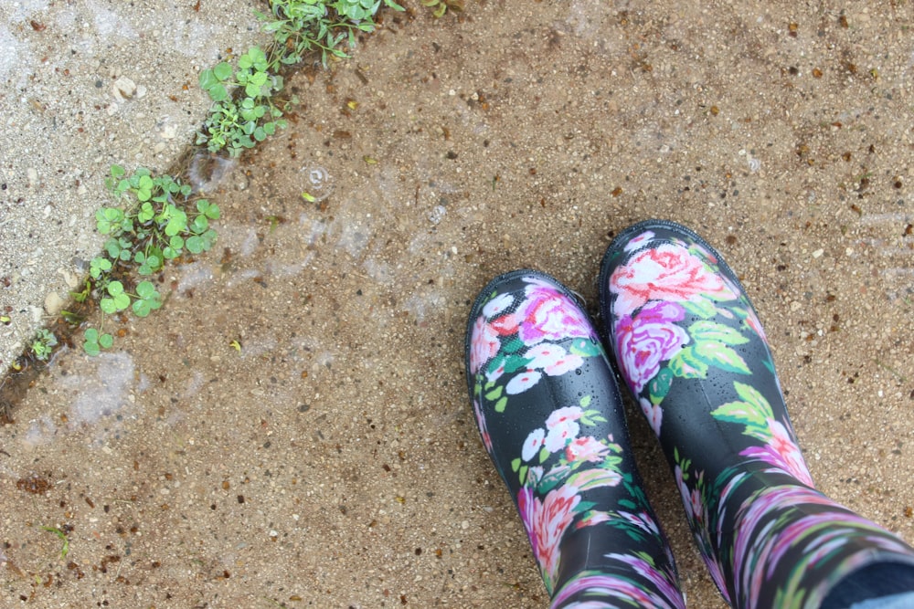 pair of black-and-multicolored floral boots