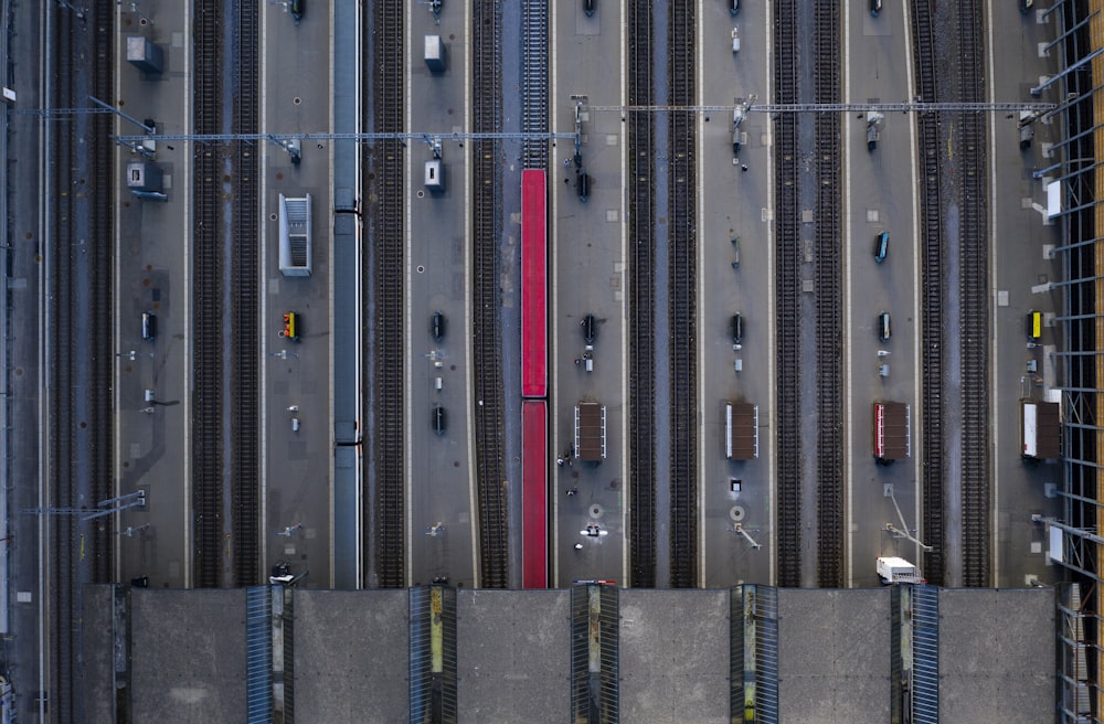 aerial photography of red trains on railway during daytime