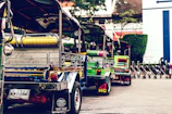 Traditional Sri Lankan tuk-tuks lined up ready for city tours in Kandy.