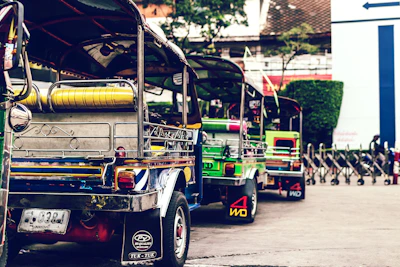 Traditional Sri Lankan tuk-tuks lined up ready for city tours in Kandy.