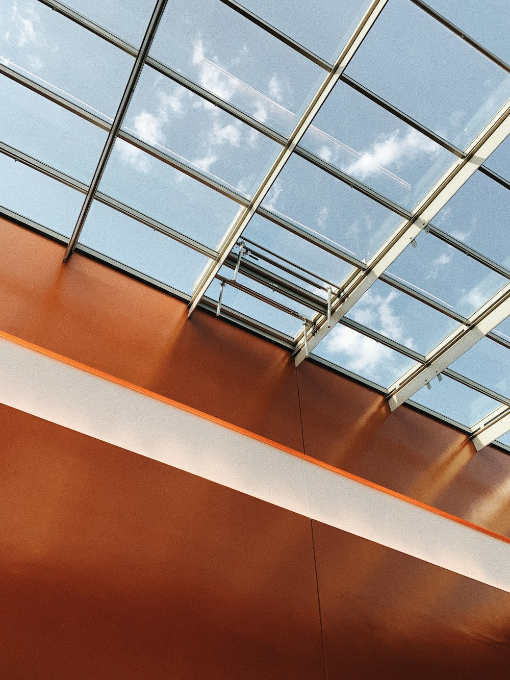 glass ceiling building during daytime close-up photography