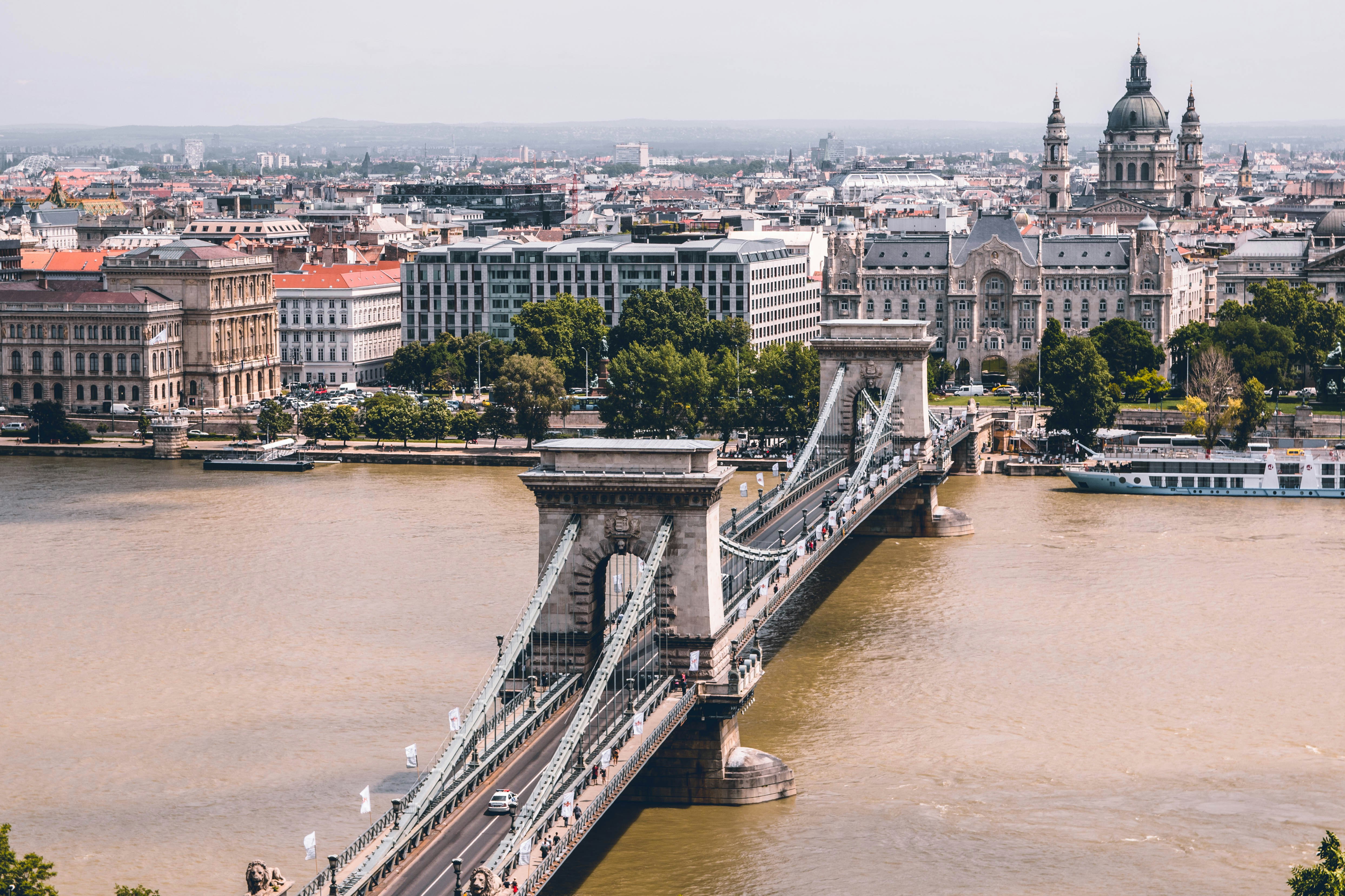 grey bridge over murky river