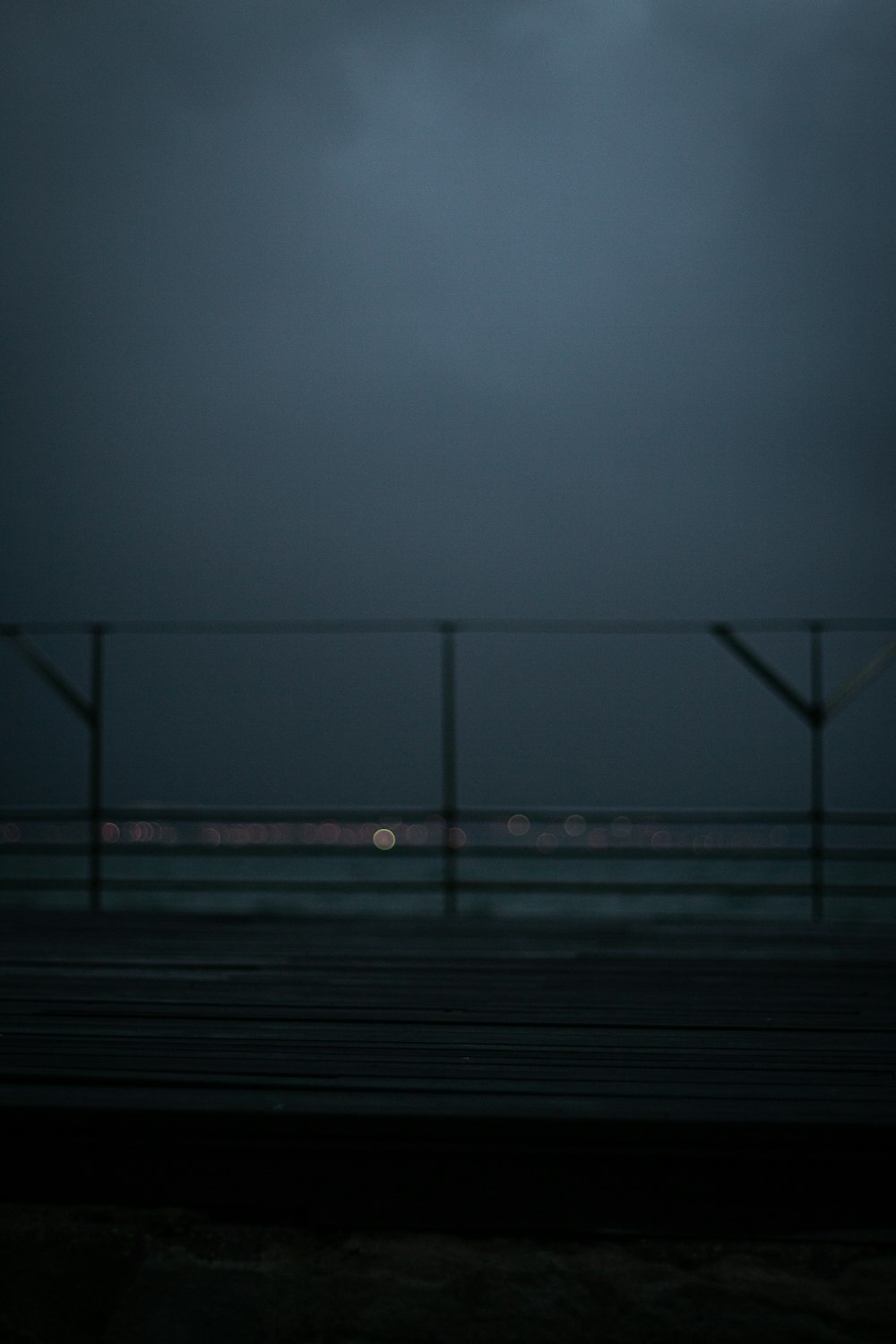 gray fence during night