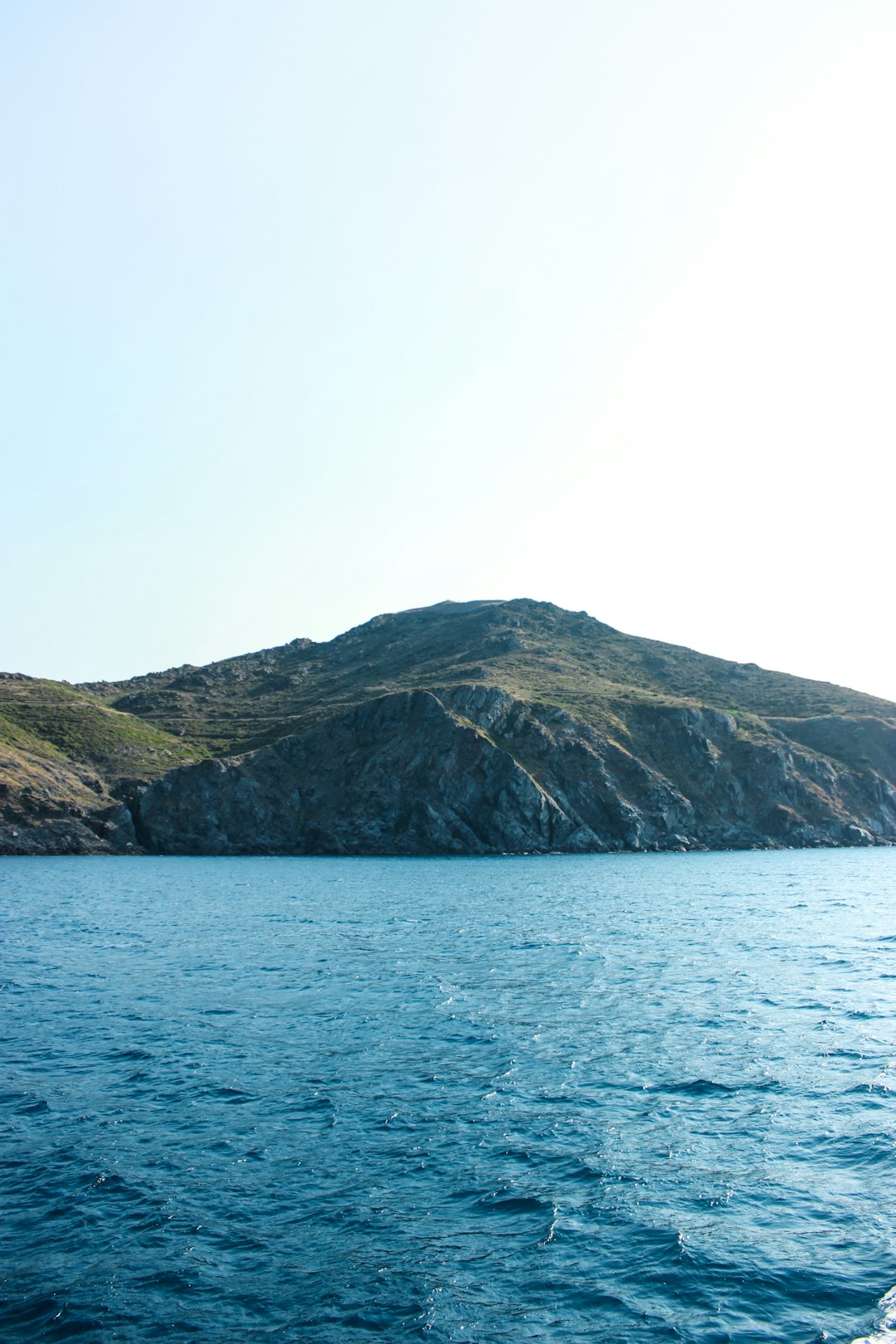 body of water beside mountain