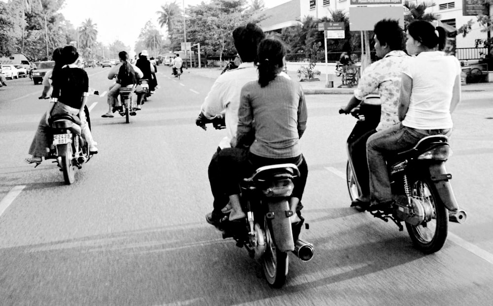 grayscale photography unknown persons riding on motorcycle