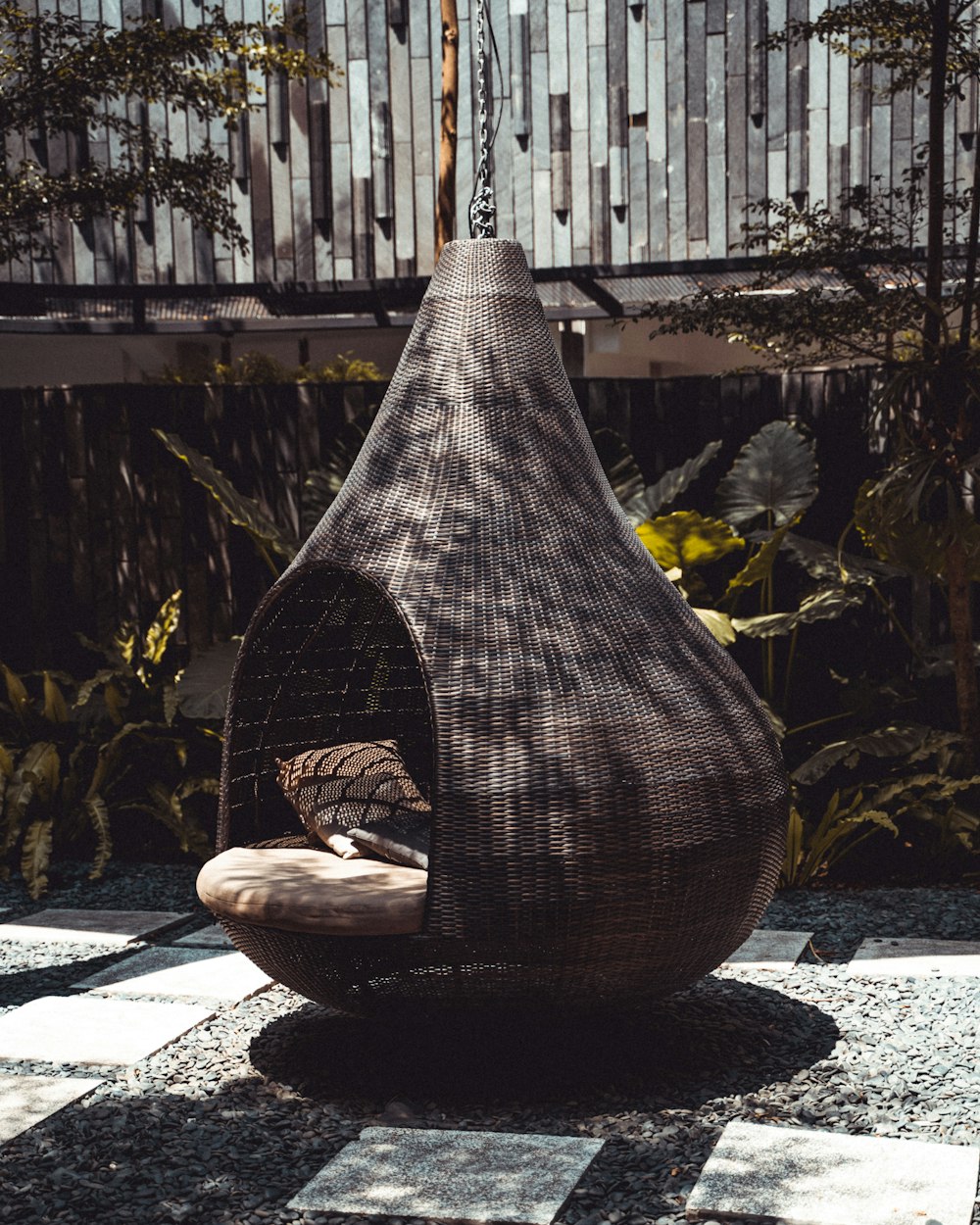 brown throw pillow in swing close-up photography