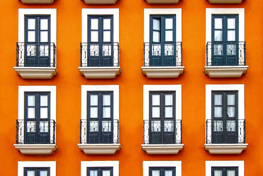 close-up photography of white and orange building during daytime