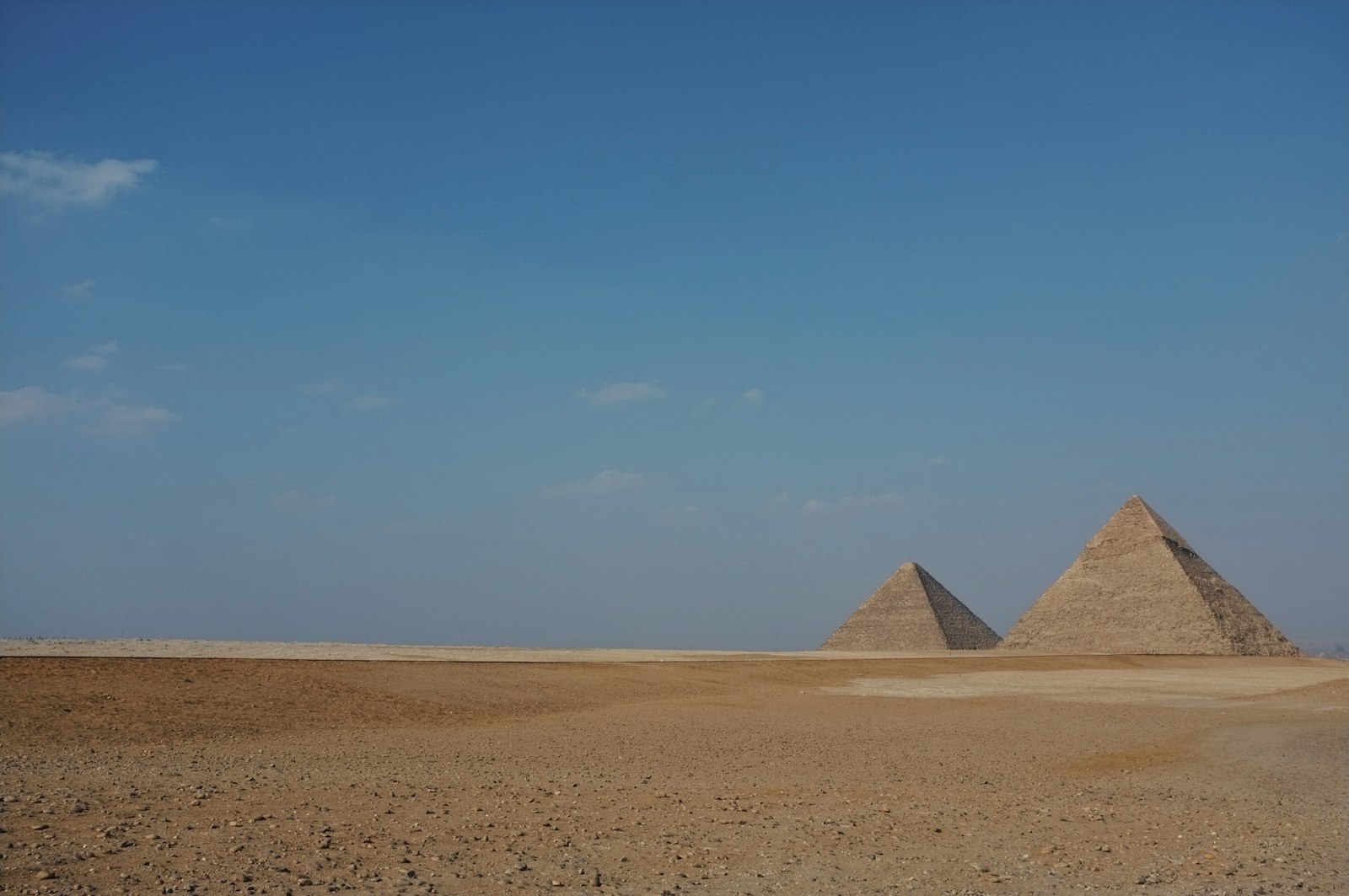 The Pyramids of Giza against a clear daytime sky