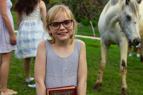 girl wearing black framed eyeglasses
