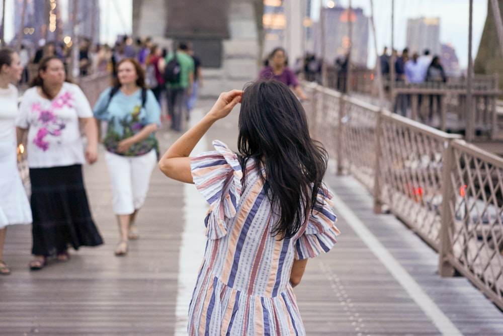 woman wearing gray and brown striped dress