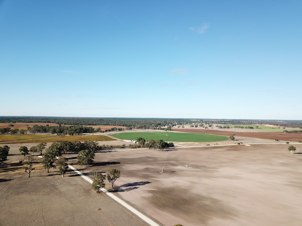 grey concrete field under blue sky