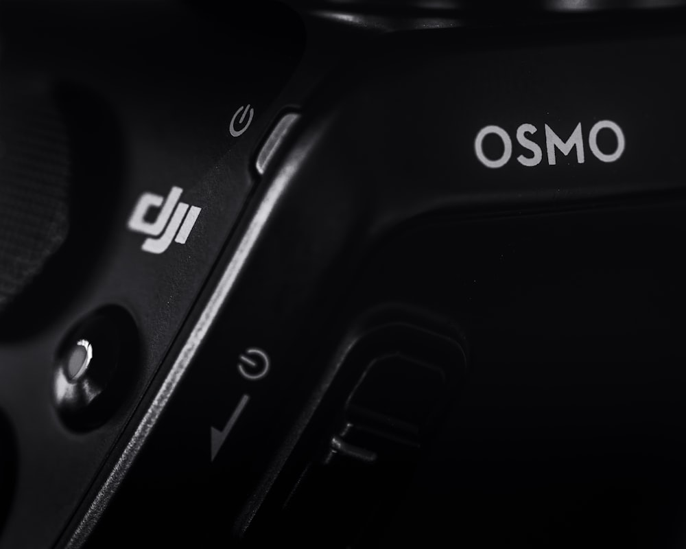 black DJi Osmo showing power button