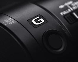 Close-up of a camera lens symbolizing the artistic focus of our photographic partners.