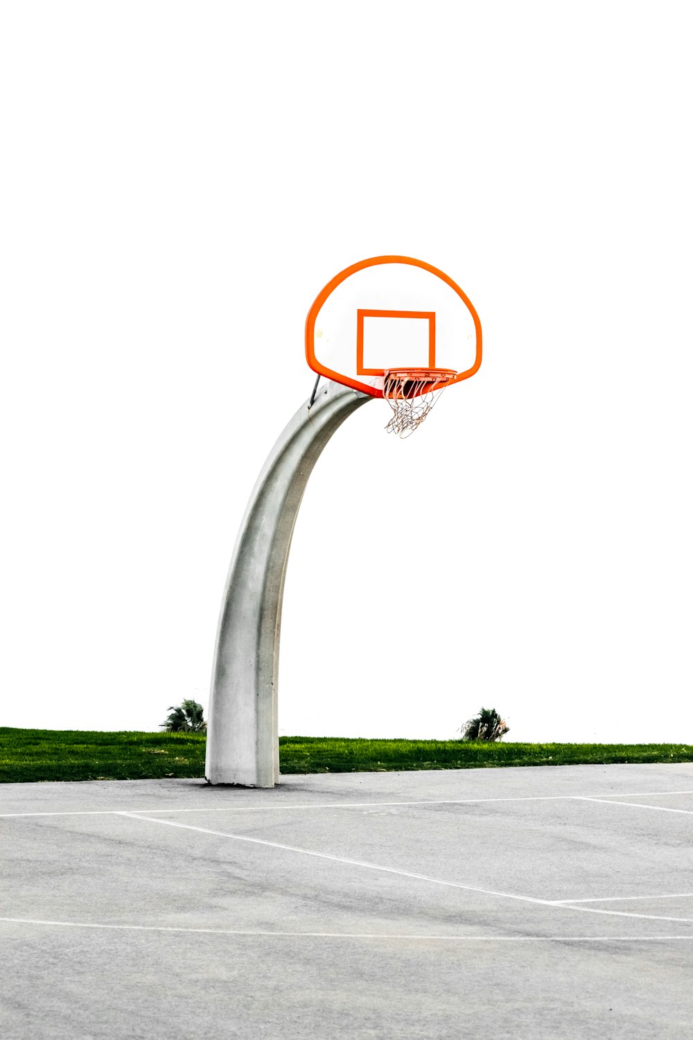 architectural photography of gray and orange basketball hoop