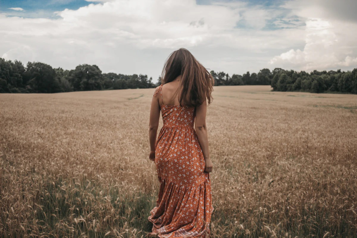 Woman standing in nature at golden hour