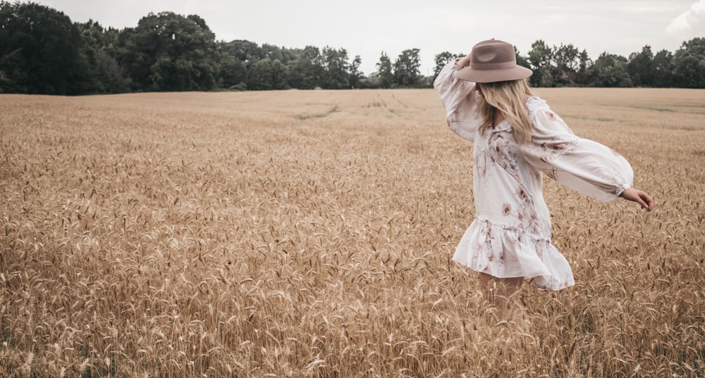 woman wearing white and pink floral long-sleeved shirt