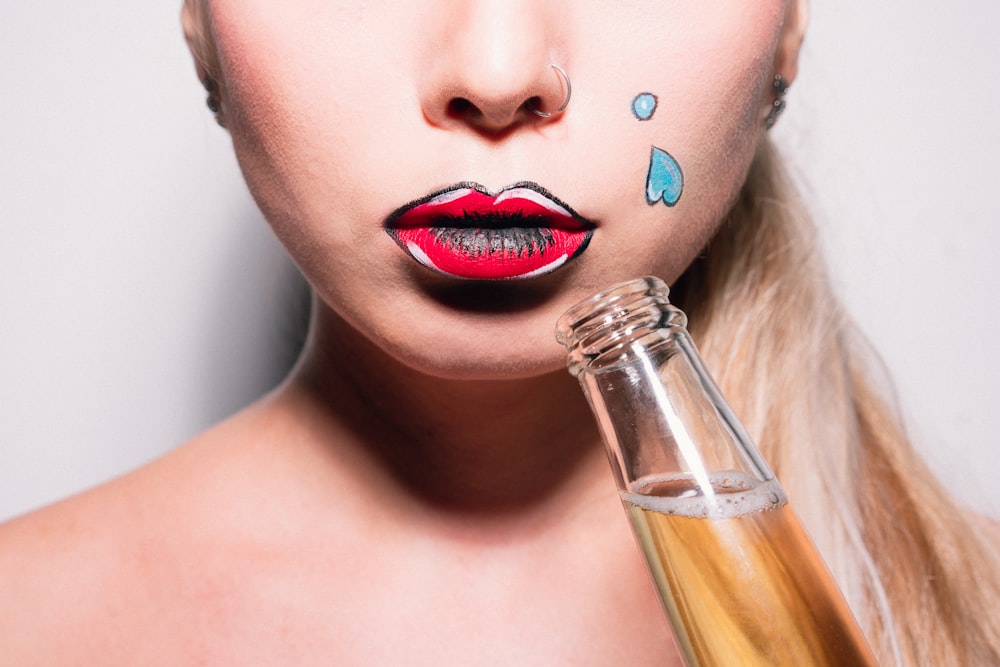 woman holding beer bottle