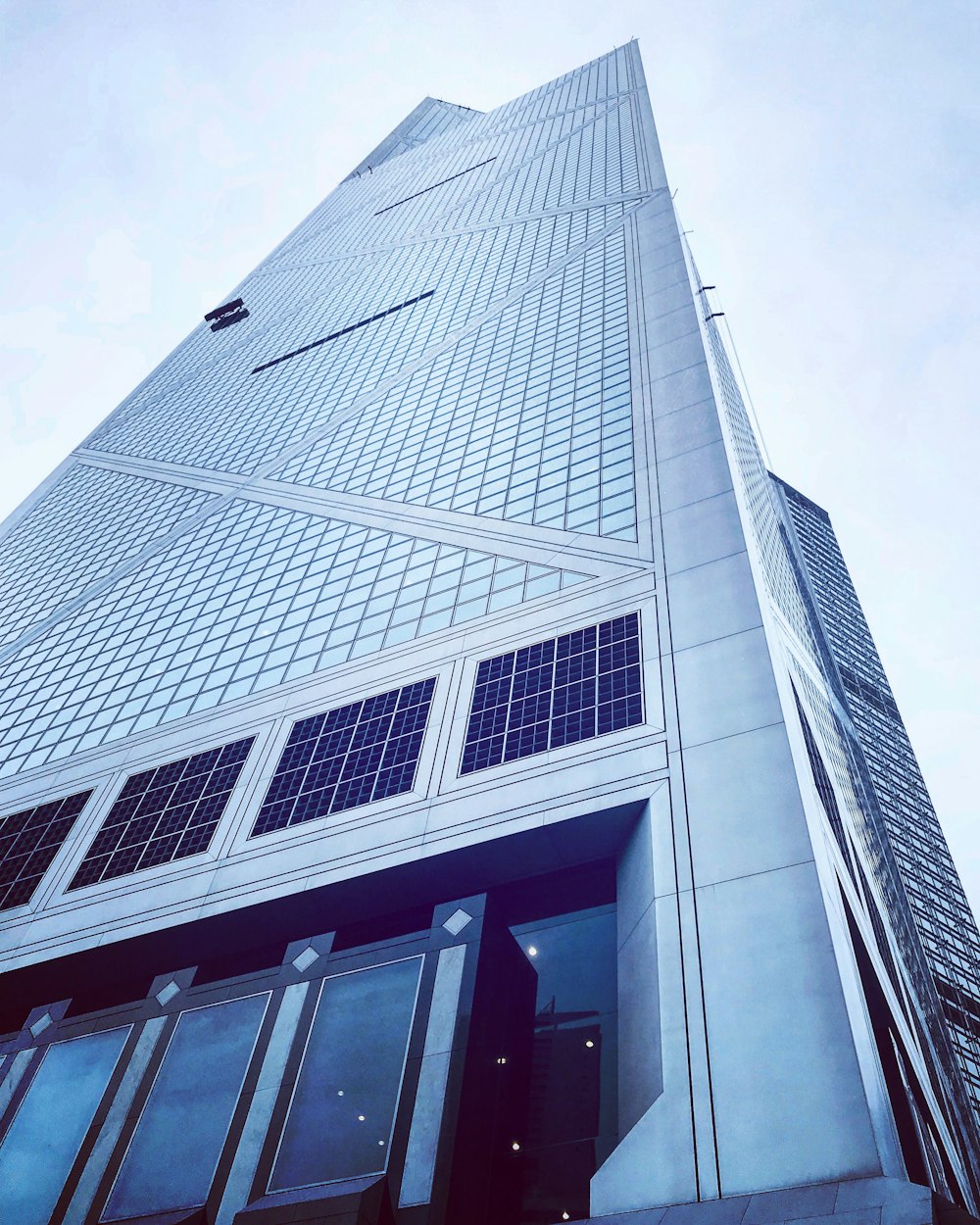 low angle photography of glass building