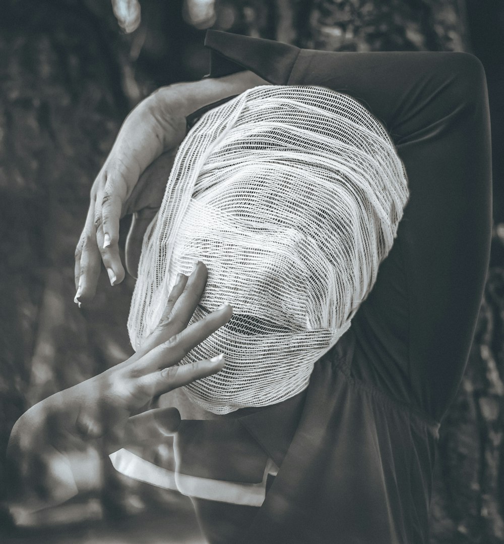 greyscale photography of people wearing black long-sleeved shirt