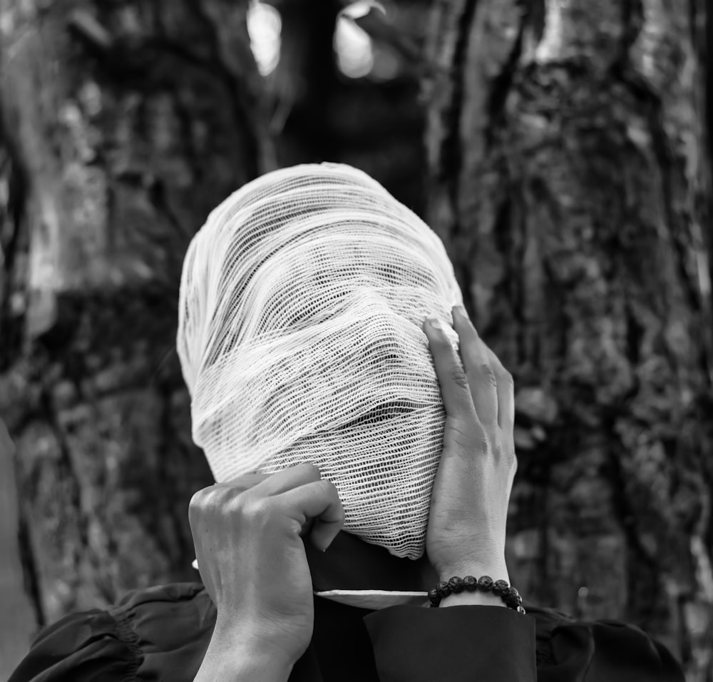 man with mask near tree