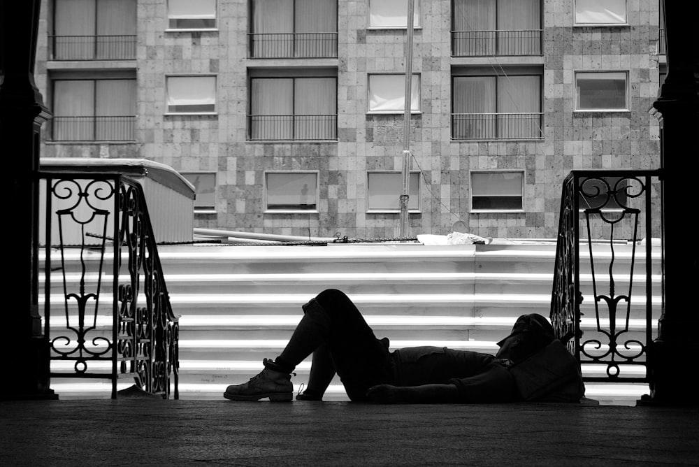 person lying near stairs