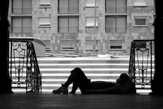 person lying near stairs