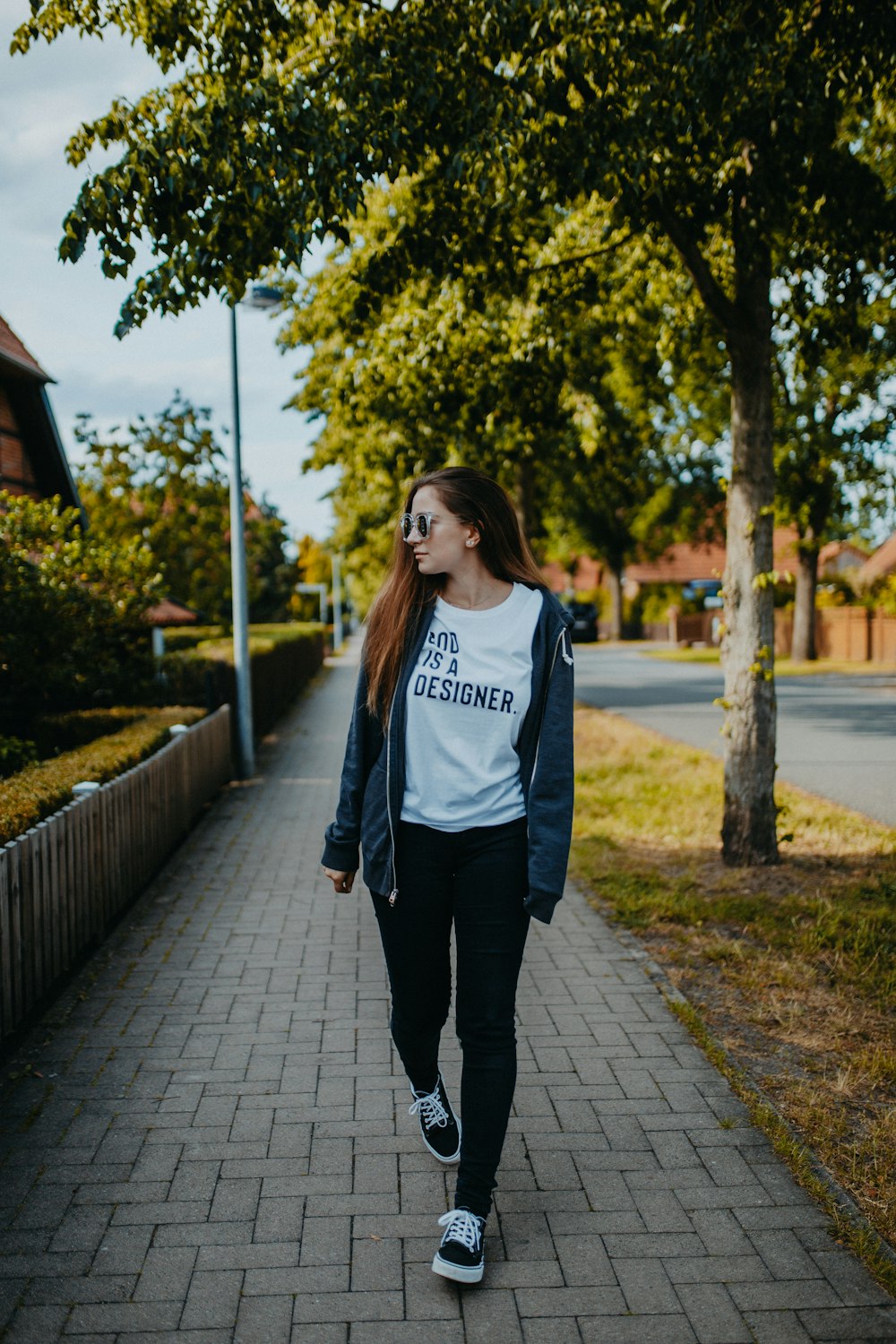 shallow focus photo of woman in black full-zip jacket and pants