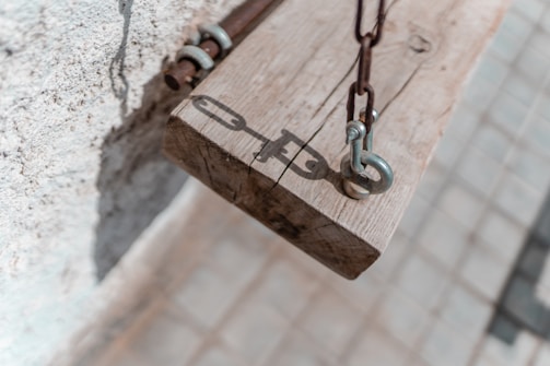 Close-up of chemical anchor grouting being applied to a beam.