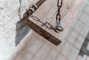 Close-up of a lifeline anchor point fixed firmly on a steel beam.