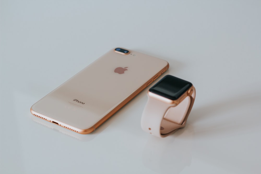 gold iPhone 8 Plus and Apple Watch