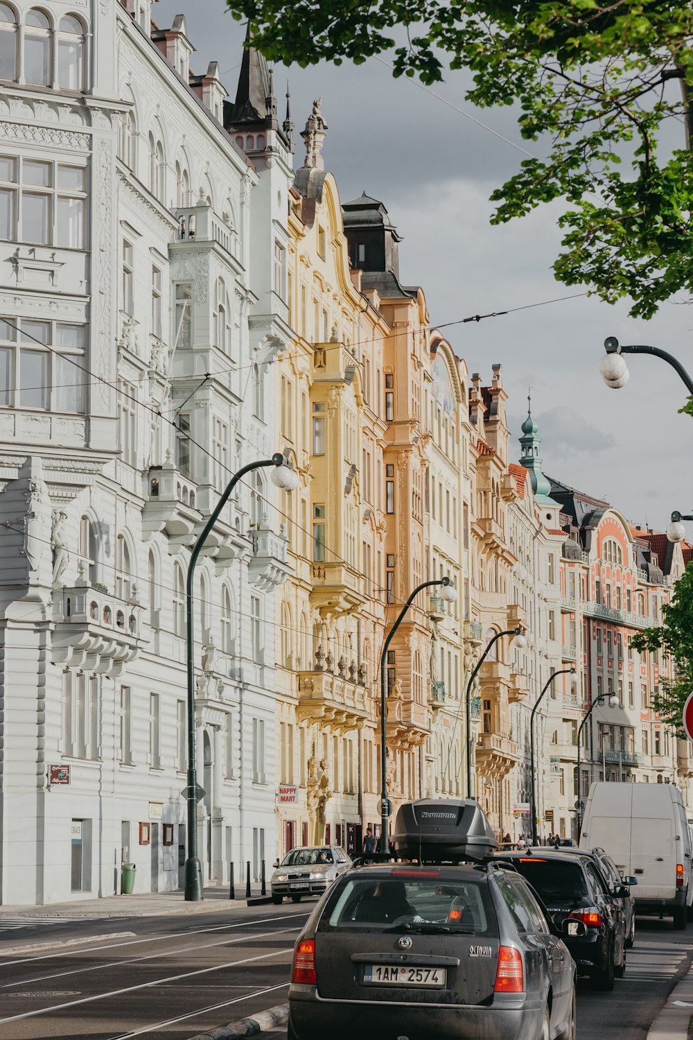 cars on traffic beside building during daytime