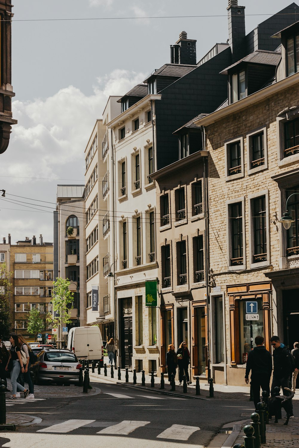 people walking beside building