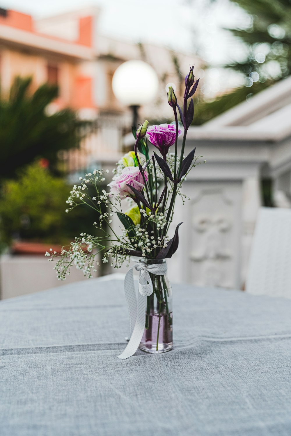 pink petaled flowers in vase