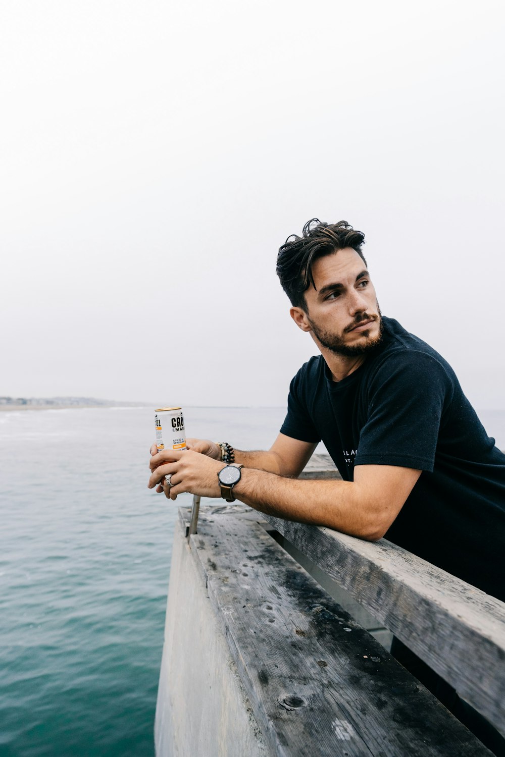 shallow focus photo of man in black crew-neck T-shirt