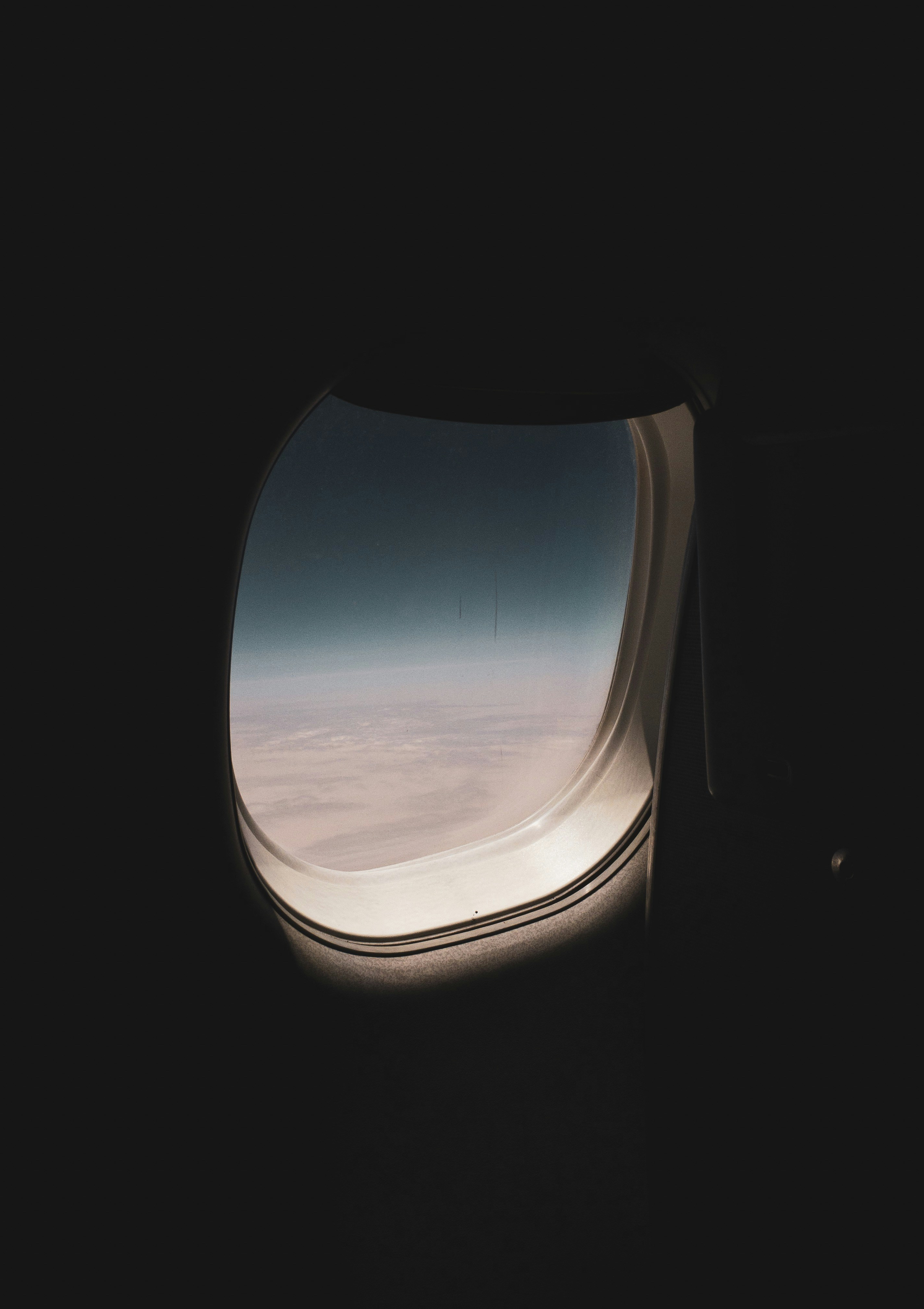 A shot of a plane window through my iPhone lens. just go people, Travel.