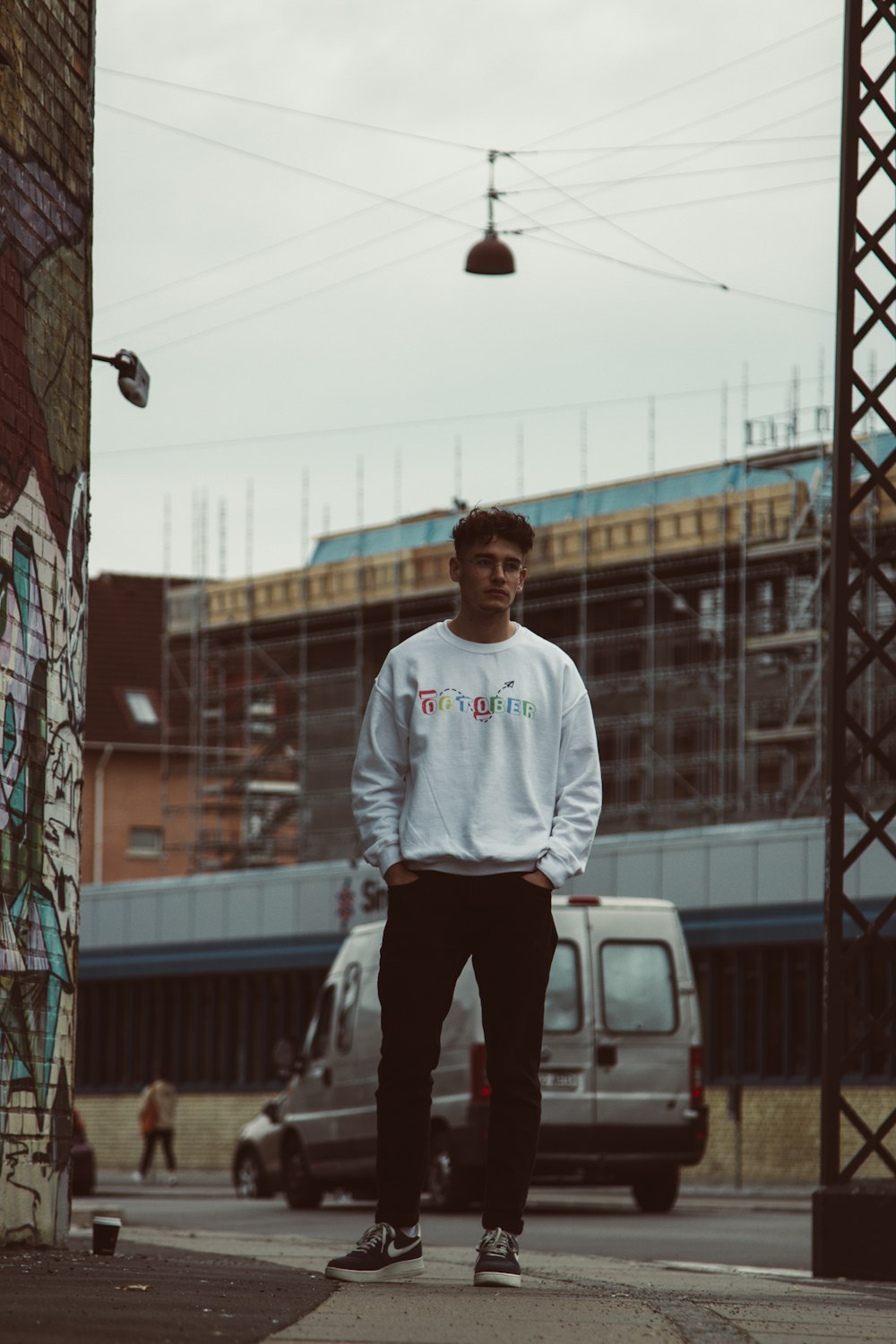 shallow focus photo of man in white crew-neck long-sleeved shirt
