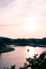 A serene boat gliding on the Nile River during sunset.